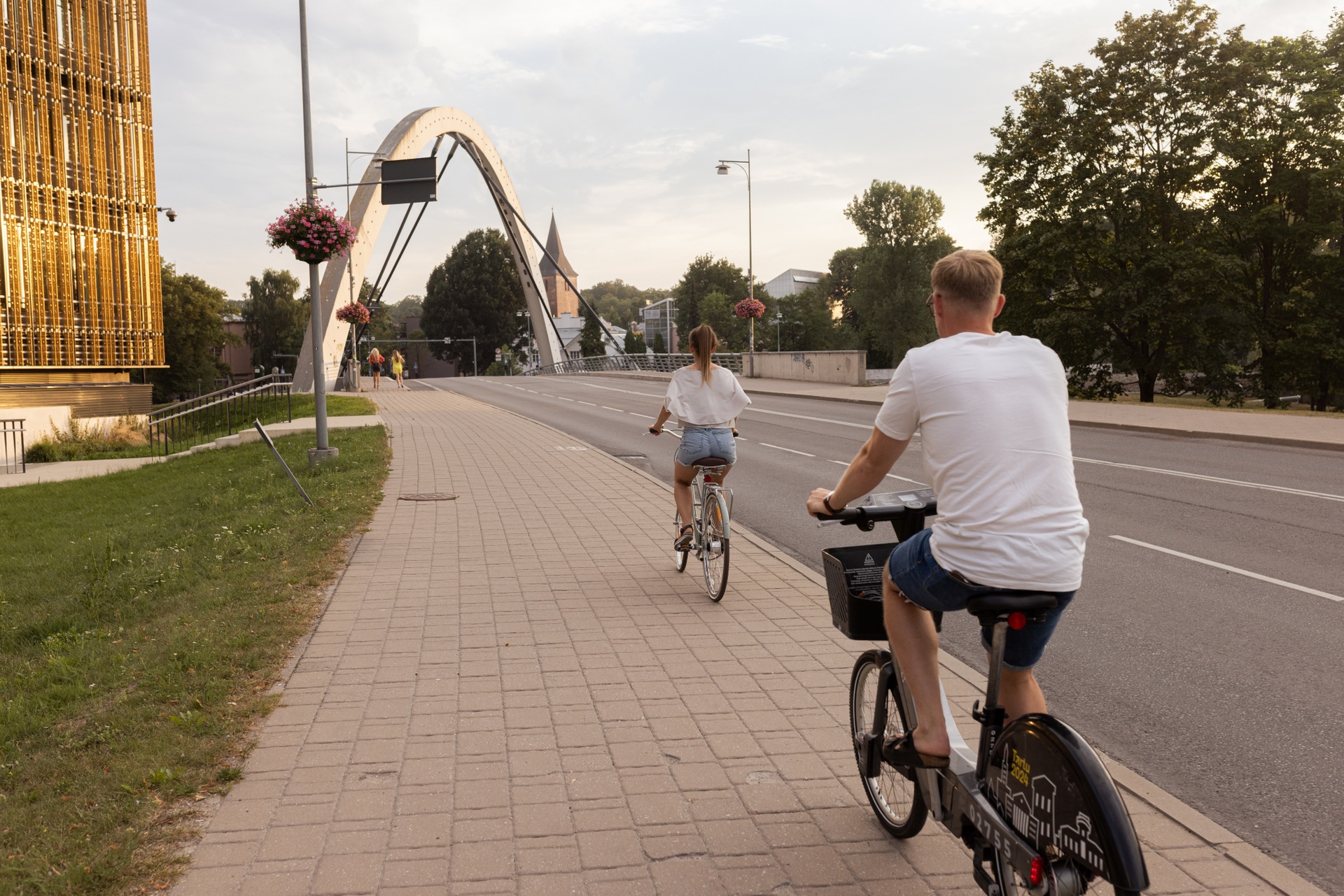 A man and woman riding bikes in Tartu, Estonia